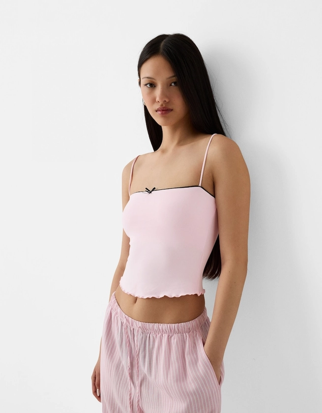 Strappy top with a bow detail