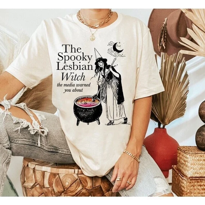 The spooky lesbian witch the media warned you about shirt | vintage lesbian shirt | lgbtq pride shirt | halloween lesbian | queer pride wlw
