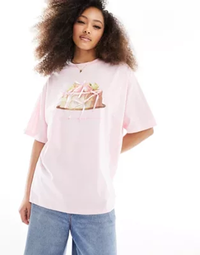 ASOS DESIGN - T-shirt oversize à imprimé gâteau avec nœuds en satin - Rose