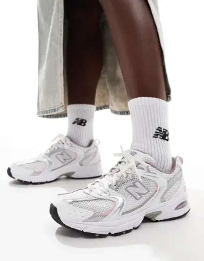 New Balance 530 trainers in white with pink details