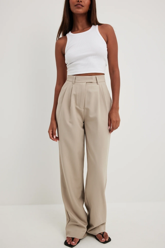 Pantalon large à plis et taille haute Beige