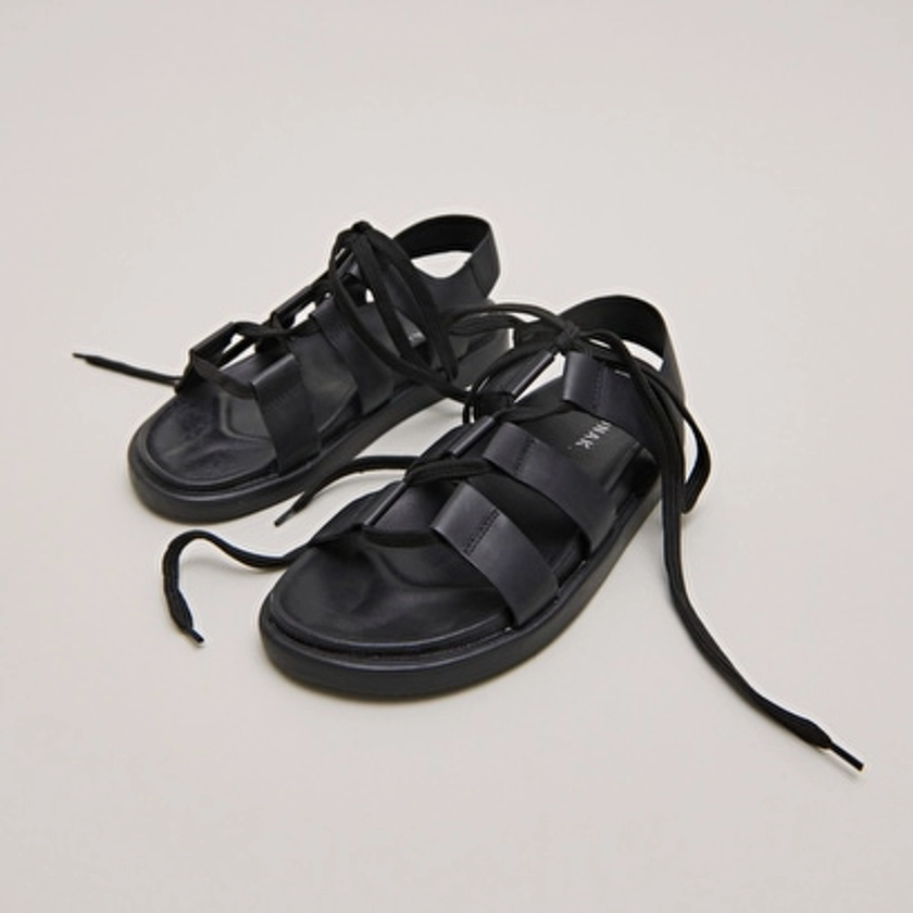 Sandals with multiple straps and laces