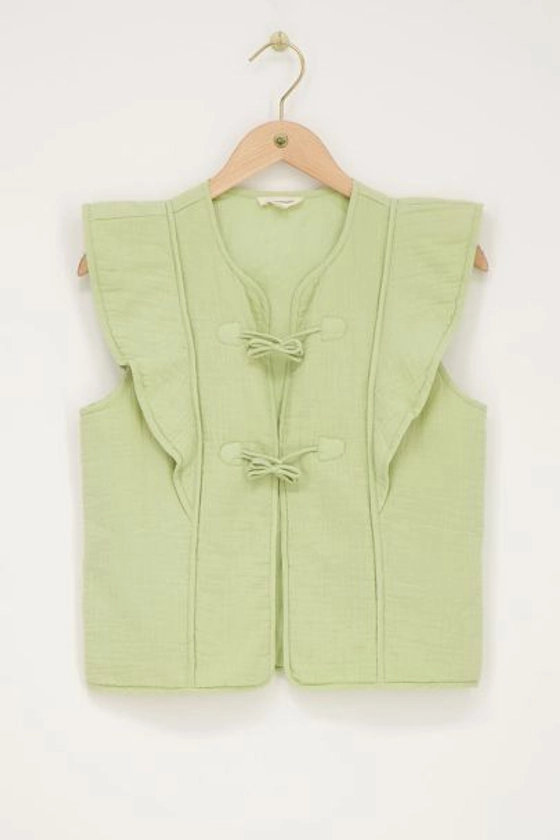 Groen gilet met strikjes en ruffles