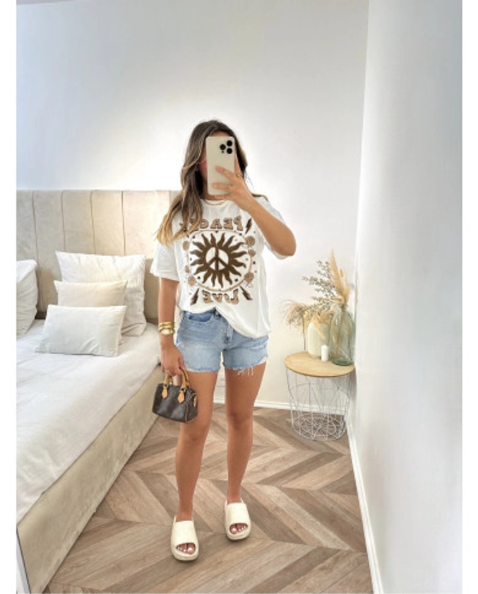 Short en jean bleu déchiré