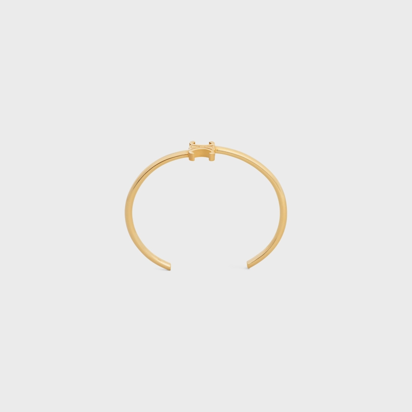 TRIOMPHE ASYMMETRIC CUFF IN BRASS WITH GOLD FINISH - GOLD | CELINE