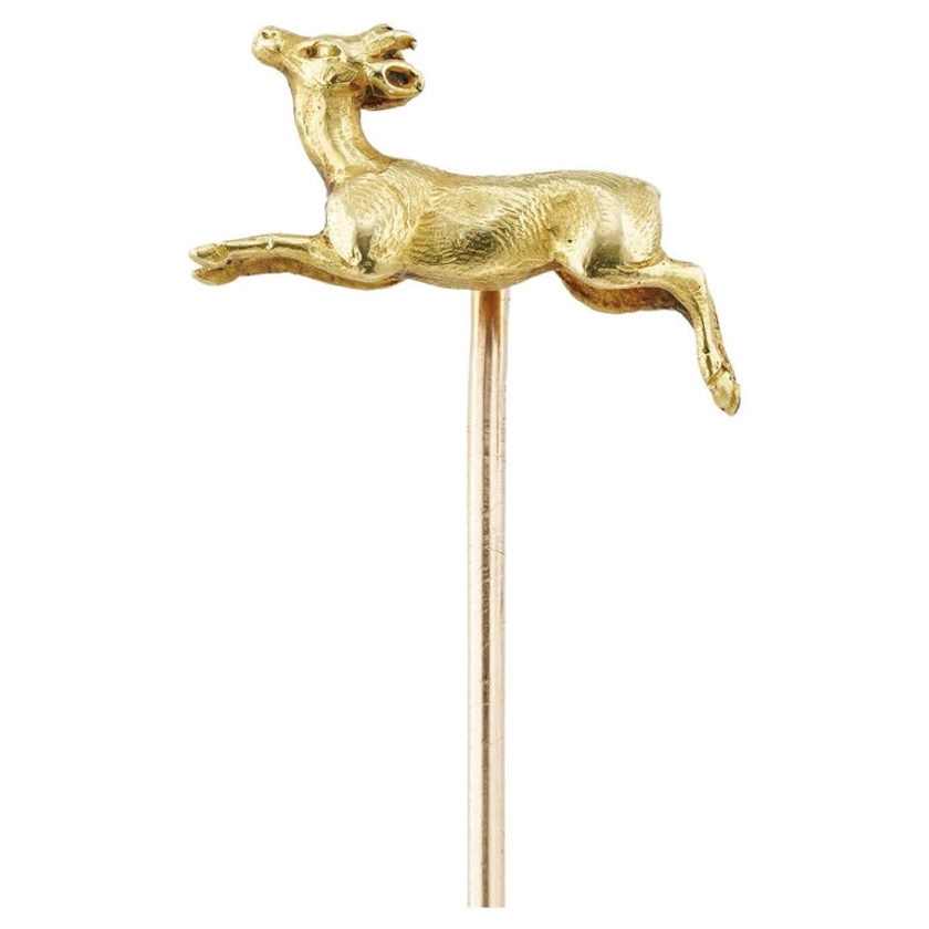 A Belle Époque gold buck stick pin