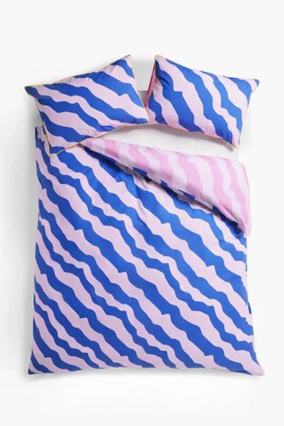 Buy Blue/Pink Reversible Bright Wave with Pipe Edge Duvet Cover and Pillowcase Set from the Next UK online shop