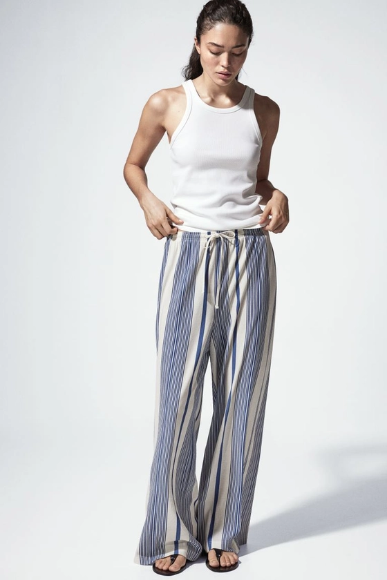 Pantalon large avec taille élastique - Taille haute - Longue - Blanc/rayures bleues - FEMME | H&M FR