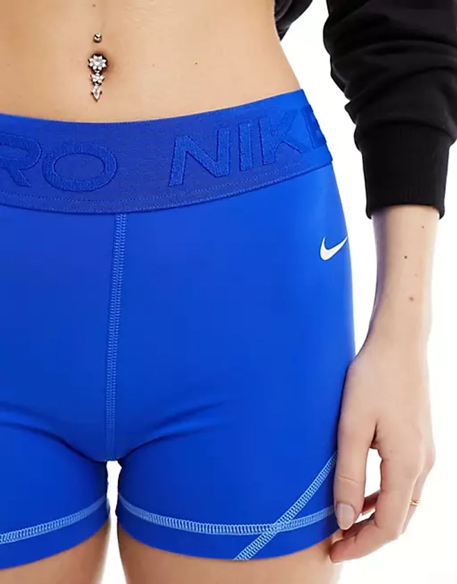 Nike Pro Training Dri-FIT gains girl mid-rise 3 inch shorts in hyper royal blue | ASOS