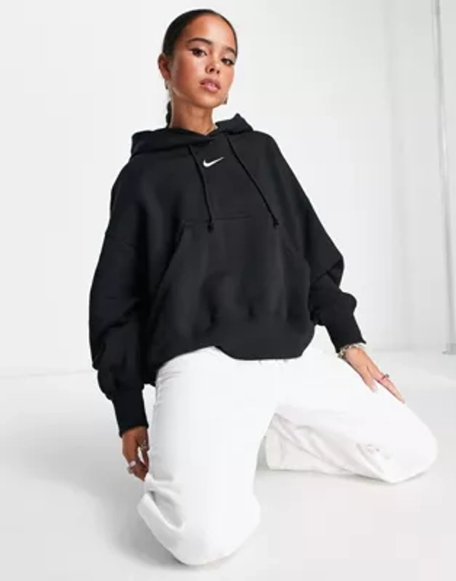 Nike mini swoosh extra oversized pullover hoodie in black and sail | ASOS