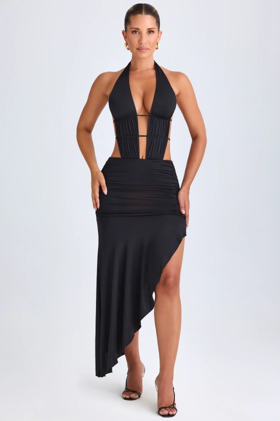 Robe mi-longue asymétrique à découpes et dos nu en noir