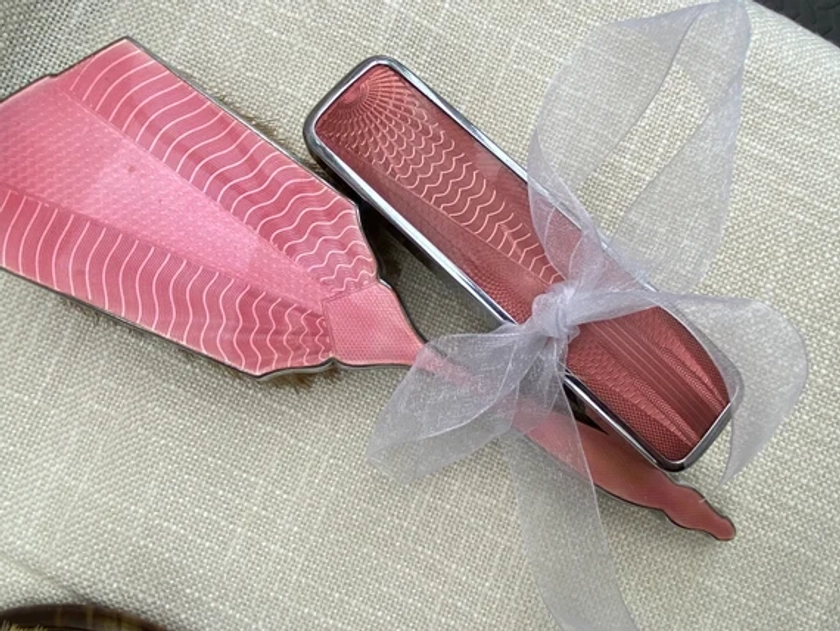 VINTAGE  pretty pink vanity/dressing table set with hair brush and clothes brush. Enamel style pink pattern to the brushes. 1950/60’s