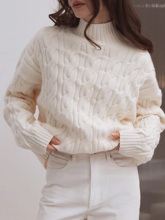 Loose cable knit jumper with high collar