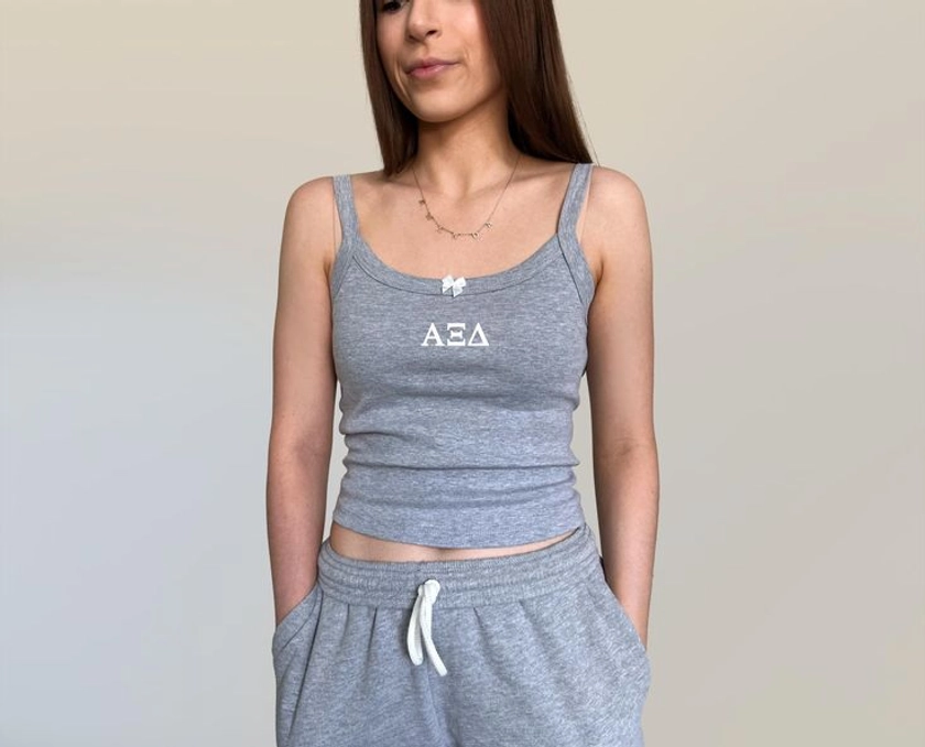 Alpha Xi Delta Bow Down Crop Top | Sorority Merch | Custom Sorority Tank Top in 2024 | Sorority tank tops, Crop tops, How to wear