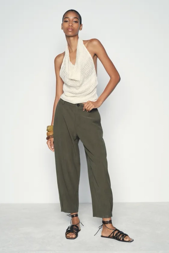 CHINO TROUSERS WITH DARTED HEMS