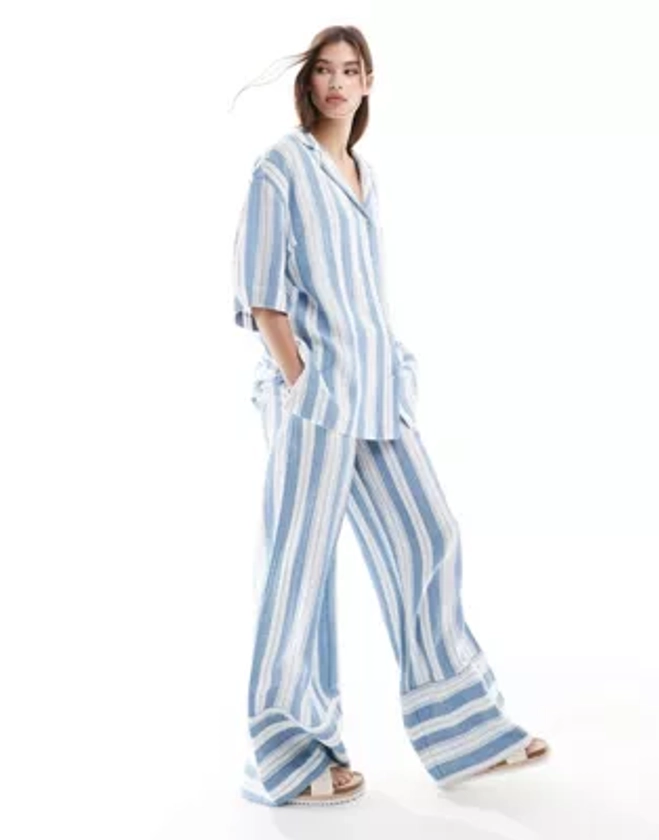 ASOS DESIGN Circular Design Collection wide leg pull on trousers in pyjama stripe | ASOS
