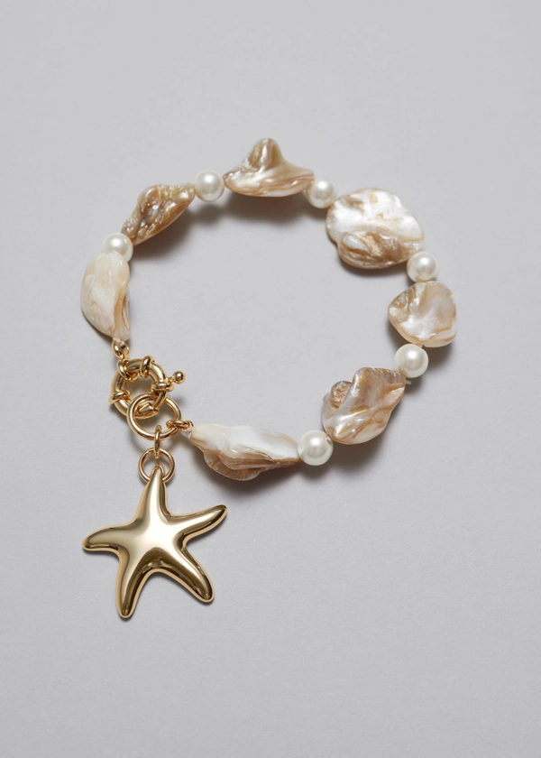 Bracelet à coquillages et pendentif étoile de mer - Ivoire - Accessories - & Other Stories FR