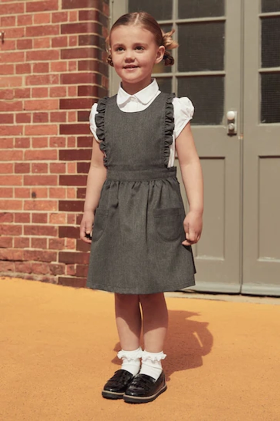 Buy Grey Ruffle Detail Pinafore School Dress (3-14yrs) from the Next UK online shop