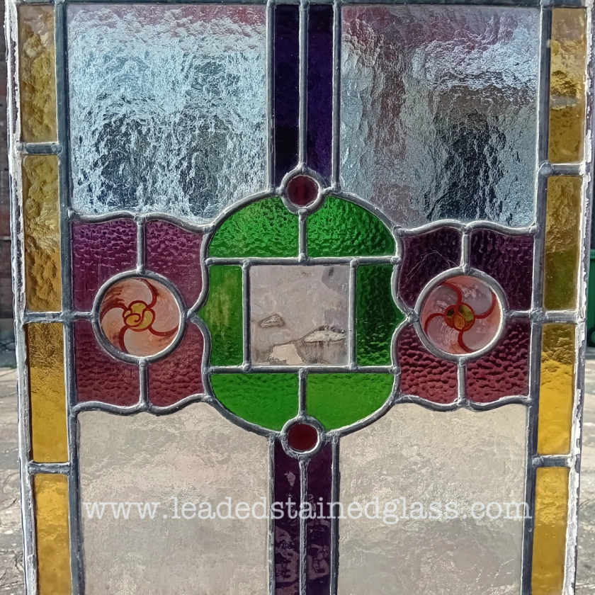 A1339i. Floral hand painted roundels in a leaded stained glass window panel