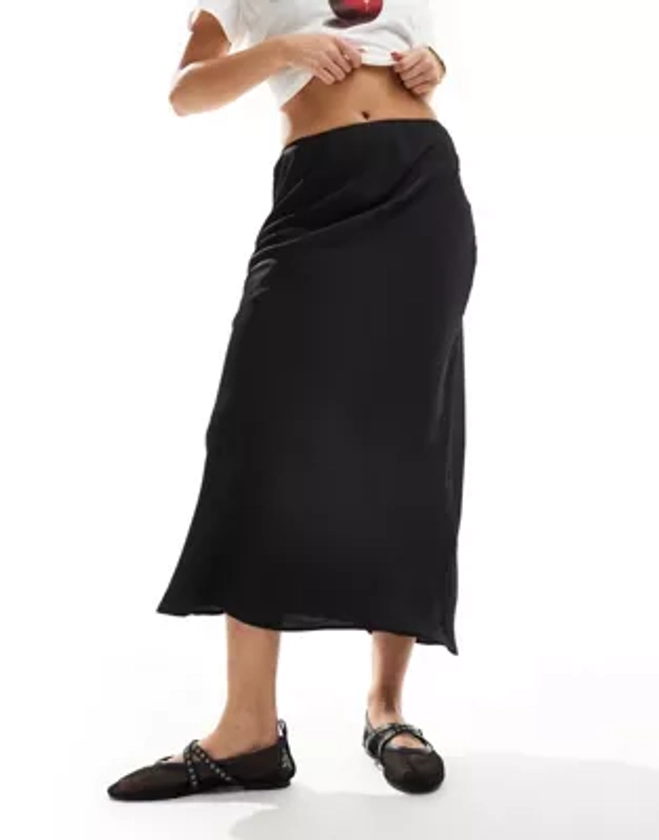 ASOS DESIGN satin bias midi skirt in black | ASOS