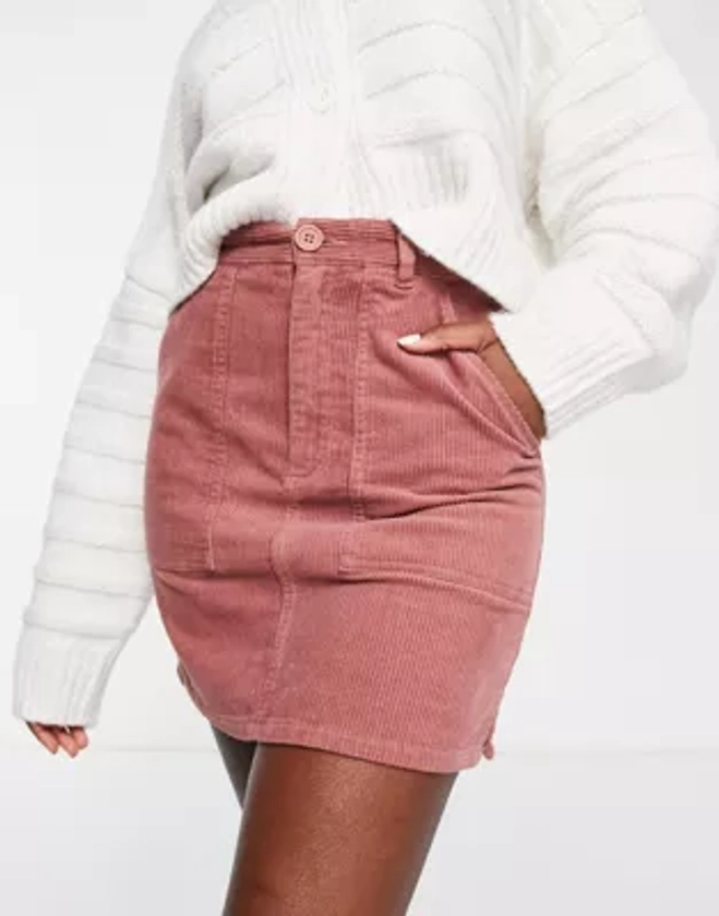 ASOS DESIGN - Mini-jupe en velours côtelé à poches plaquées - Rose