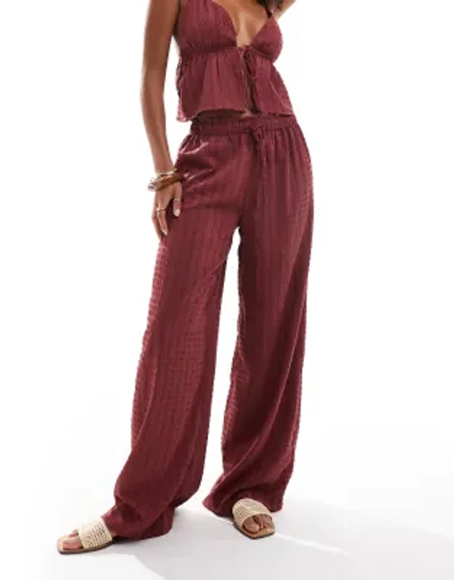 Esmee Exclusive beach textured wide leg trouser co-ord in cherry red | ASOS