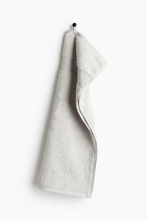 Serviette en coton éponge doux - Gris clair - Home All | H&M FR