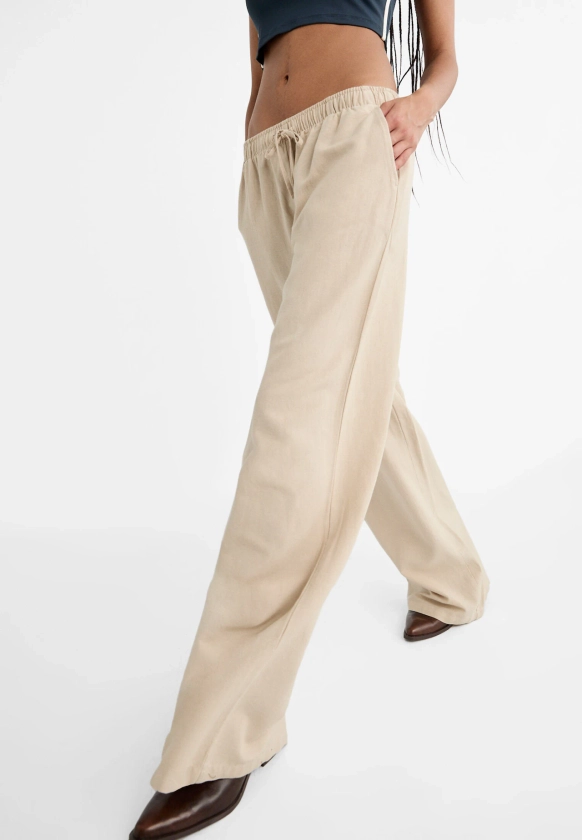 Loose-fitting linen blend trousers