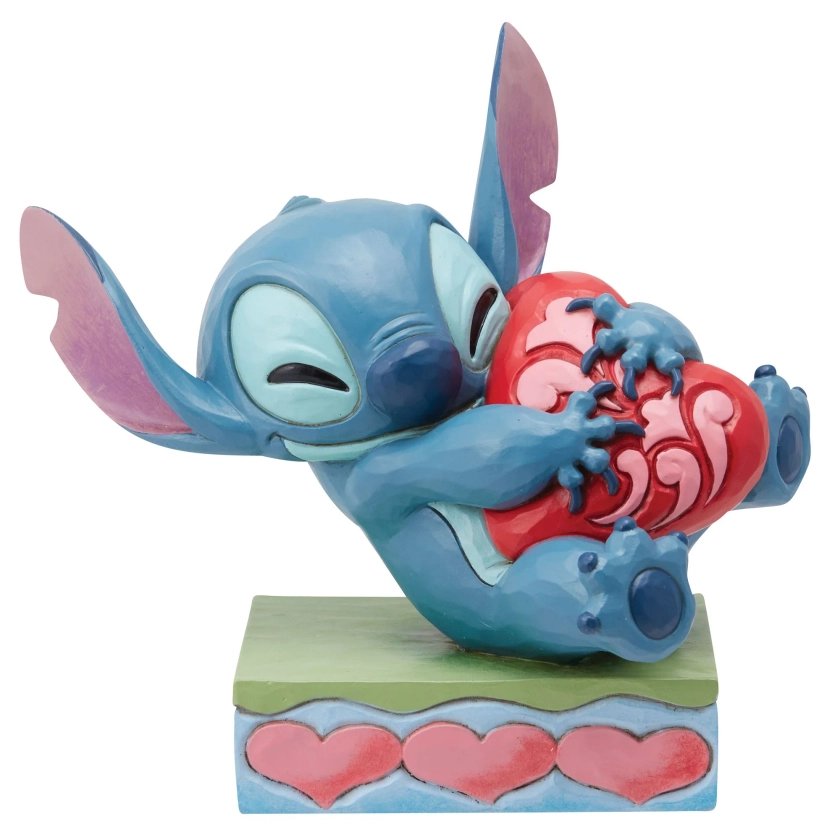 Figurine Stitch câlinant un coeur - Disney Traditions