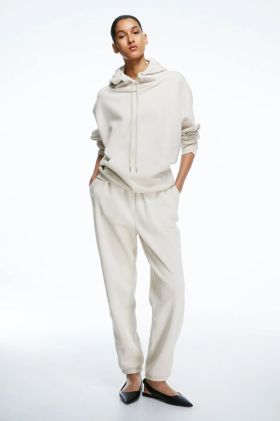 Pantalon en molleton de coton mélangé - Taille haute - Longue - Beige clair - FEMME | H&M CH