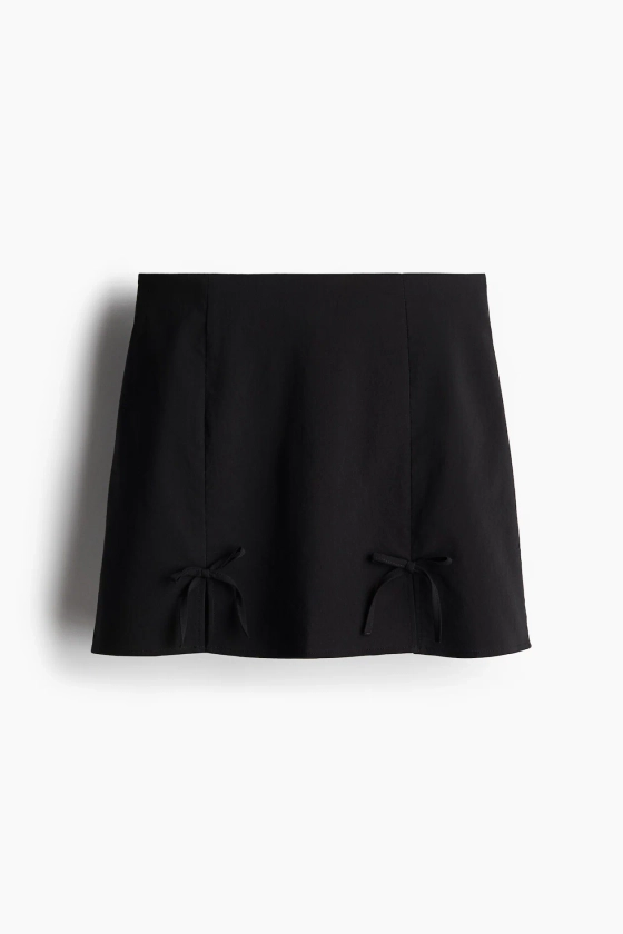 Minijupe avec nœuds - Taille basse - Mini - Noir - FEMME | H&M FR