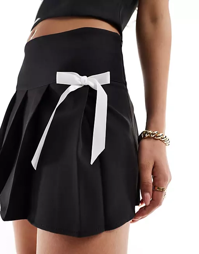 Kaiia bow bandeau top and pleated bow detail mini skirt co-ord in black | ASOS