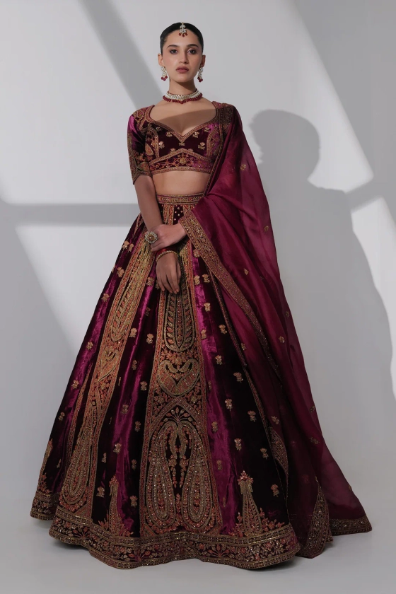 Buy Burgundy Pure Silk Velvet Hand Embroidery Mughal Nadia Bridal Lehenga Set For Women by Taisha Online at Aza Fashions.