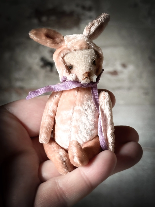 A beautiful hand made jointed collector’s teddy bear with bunny pyjama