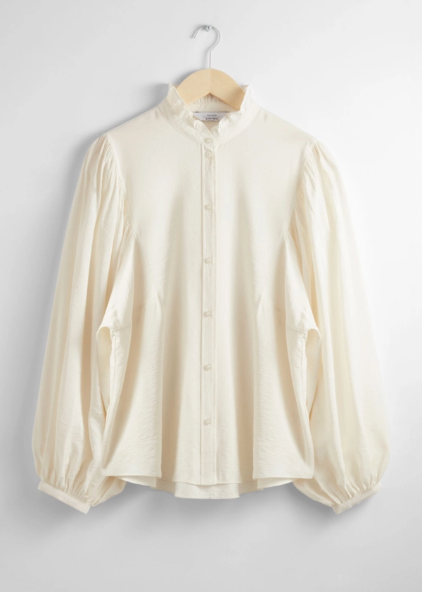 Blouse à col volanté