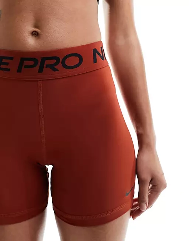 Nike Pro Training Dri-Fit 5 inch shorts in rugged orange | ASOS
