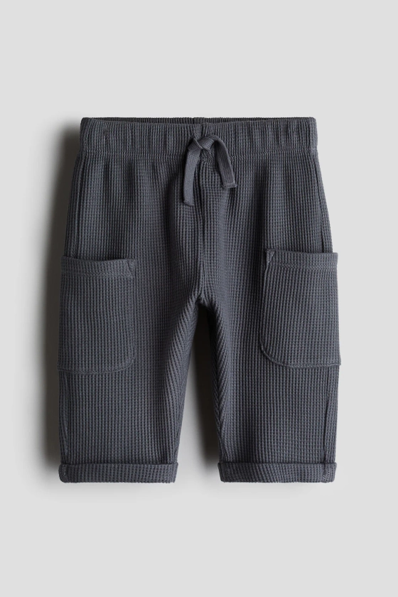 Waffled cotton trousers - Regular waist - Long - Dark grey - Kids | H&M GB