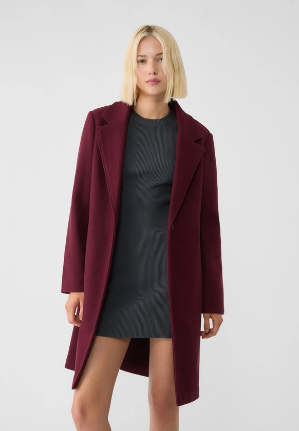 Manteau midi bouton doux au toucher