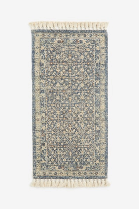 Tapis à motif avec franges