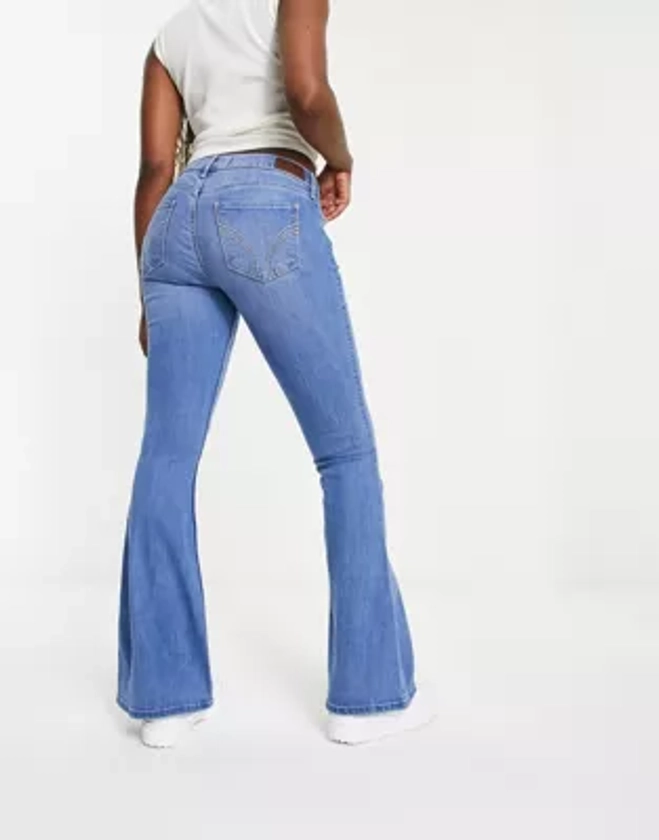 Hollister - Jean évasé à taille basse - Bleu moyen | ASOS