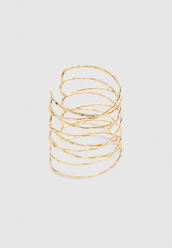 Bracelet manchette rigide rond entrelacé - Bijoux femme | Stradivarius France