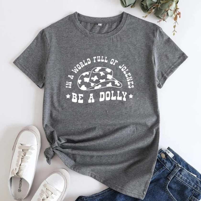 In A World Full Of Jolene's Be A Dolly Tee, Country Music Concert Attire, Western Cowgirl Shirts, Country Music Tops, Country Gift.