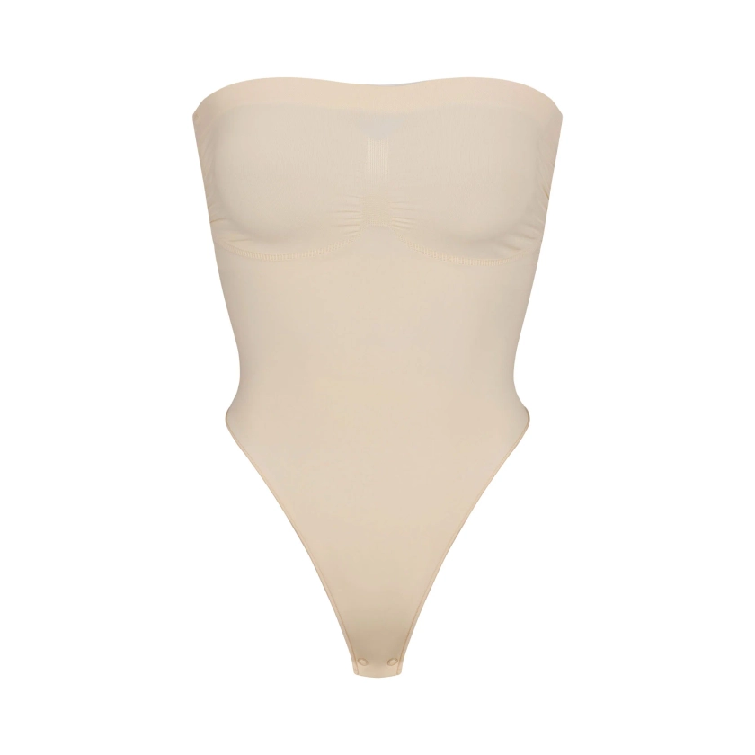 SEAMLESS SCULPT STRAPLESS THONG BODYSUIT | SAND