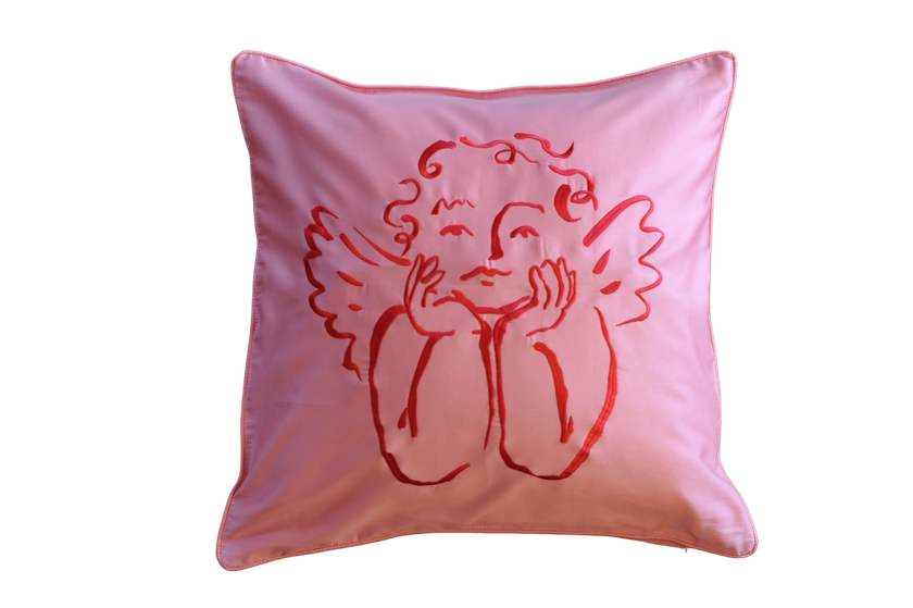 An Sukun x Olivia Sewell collaboration of a hot Rose pink Cushion with red cherub embroidery — Sukun: Luxurious bedding and homeware.