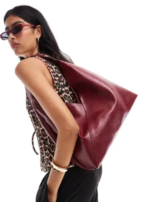 ASOS DESIGN slouch tote bag with crossover panel detail in burgundy | ASOS