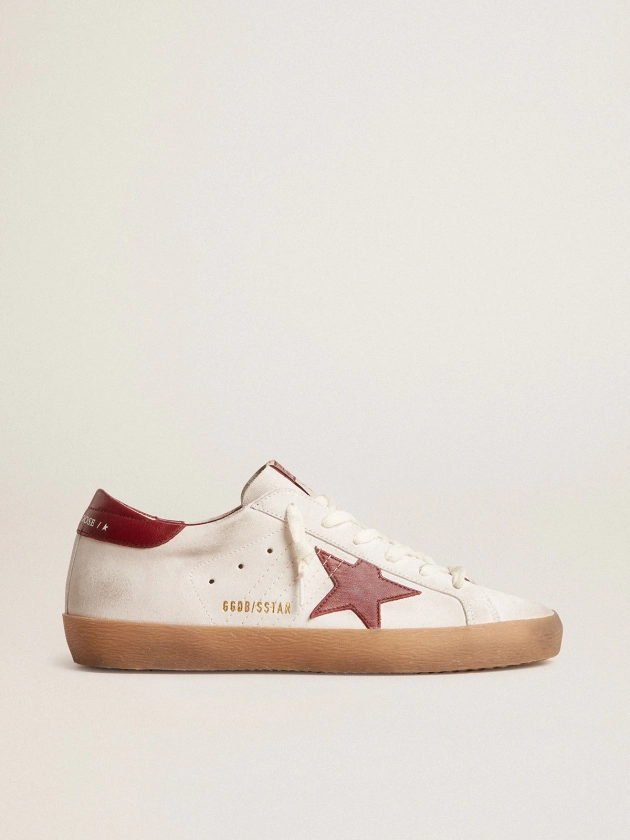 Super-Star in white suede with burgundy leather star and heel tab | Golden Goose