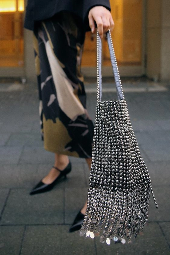 SHOULDER BAG WITH METAL APPLIQUÉS