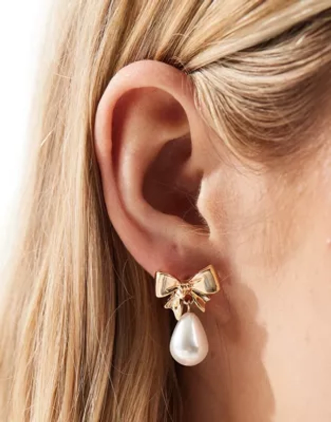 ASOS DESIGN earrings with mini bow and faux pearl drop design on gold tone | ASOS
