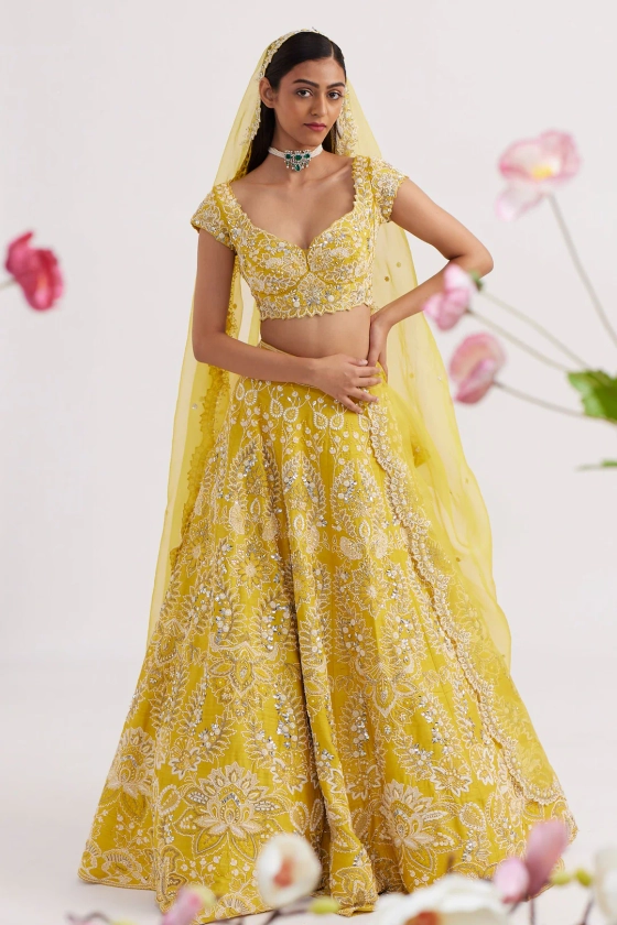 Buy Yellow Raw Silk Hand Work Pearl Round Floral Embroidered Bridal Lehenga Set For Women by Vaishali Agarwal Online at Aza Fashions.