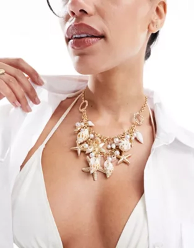 South Beach under the sea starfish and shell embellished statement necklace in gold | ASOS